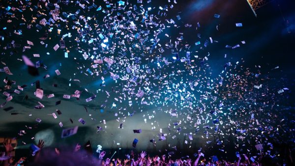 New Years Eve celebration with confetti and stage lights